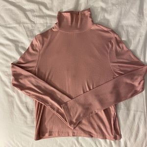 Pink long sleeve turtle neck.